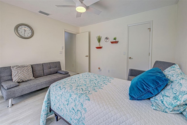 bedroom featuring hardwood / wood-style flooring and ceiling fan