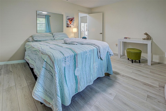 bedroom with light wood-type flooring