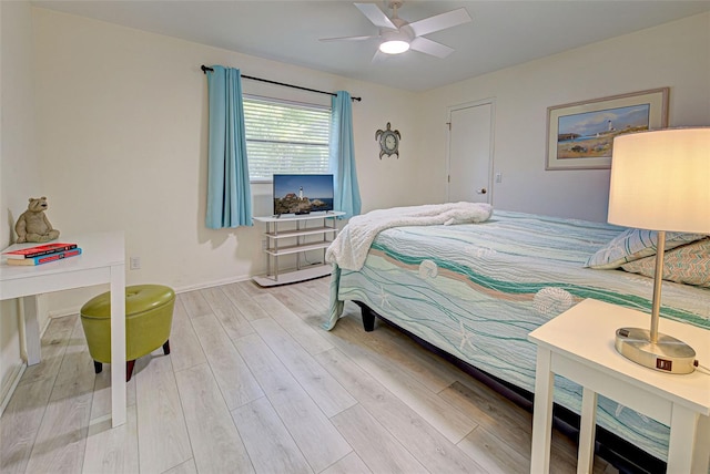 bedroom with light wood-type flooring and ceiling fan