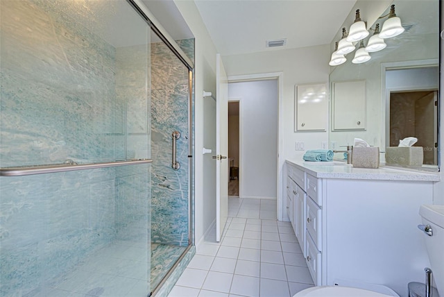 bathroom featuring vanity, tile patterned floors, and an enclosed shower