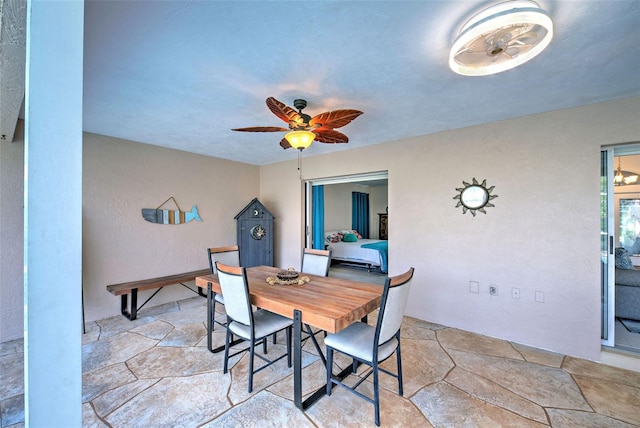 dining space with ceiling fan