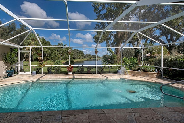 view of swimming pool with a patio area, a lanai, and a water view