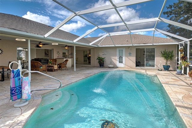 view of pool with a patio, a lanai, and ceiling fan