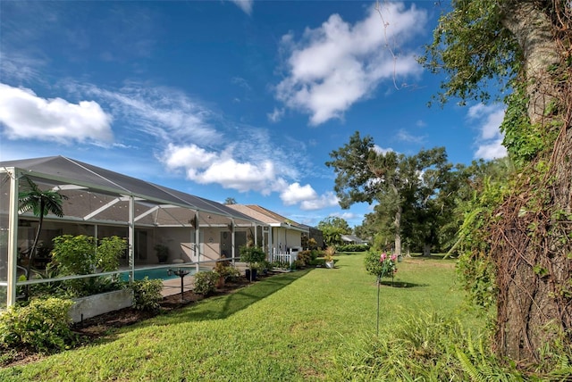 view of yard featuring a lanai