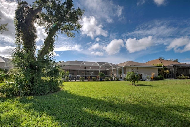 view of yard featuring glass enclosure