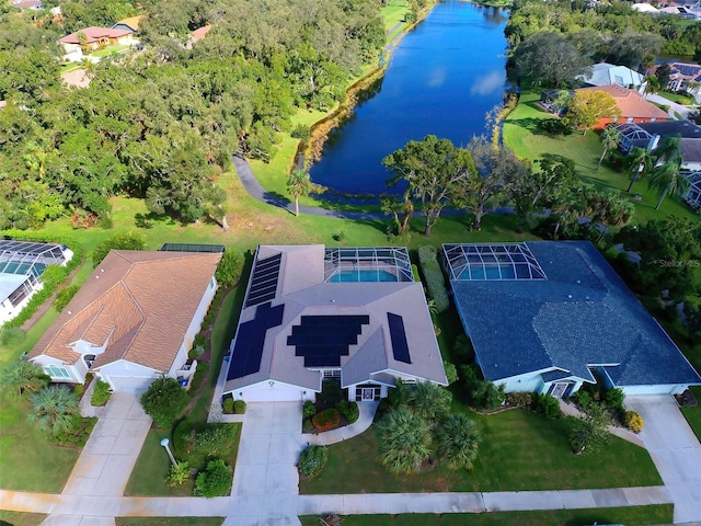 birds eye view of property with a water view