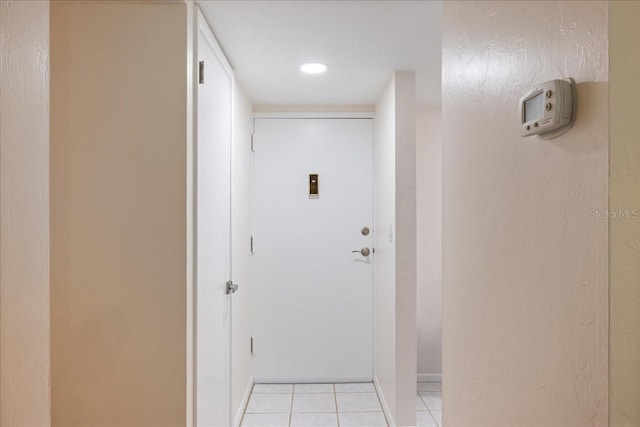 hall with light tile patterned flooring