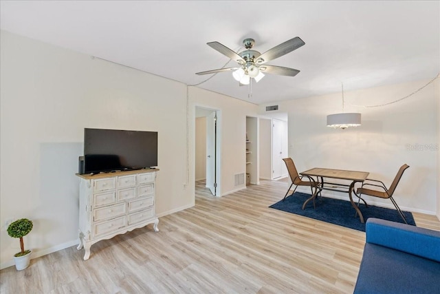 interior space with light hardwood / wood-style floors and ceiling fan