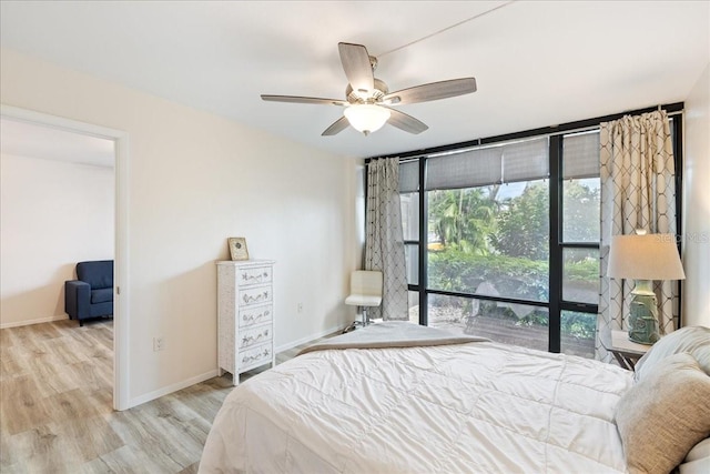 bedroom featuring ceiling fan and light hardwood / wood-style flooring