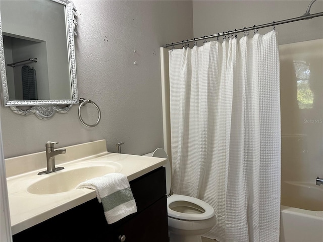 full bathroom featuring toilet, vanity, and shower / tub combo with curtain