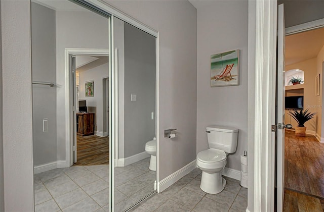 bathroom with tile patterned floors and toilet