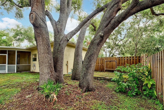 view of yard featuring a sunroom