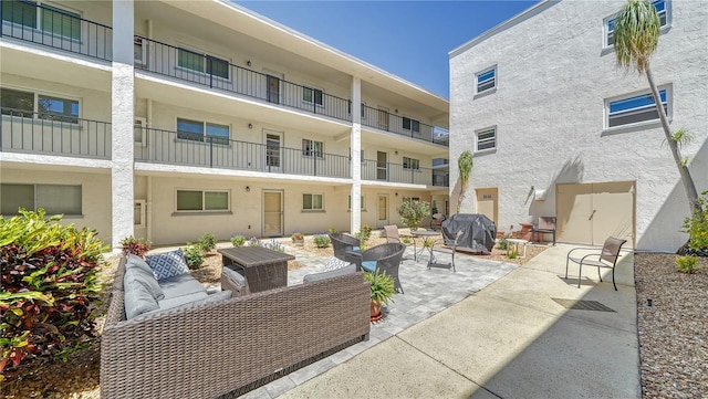 view of patio / terrace with an outdoor hangout area and grilling area