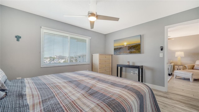 bedroom featuring ceiling fan and light hardwood / wood-style floors