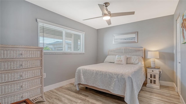 bedroom featuring ceiling fan and light hardwood / wood-style flooring