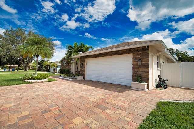 view of front of home with a garage and a front yard