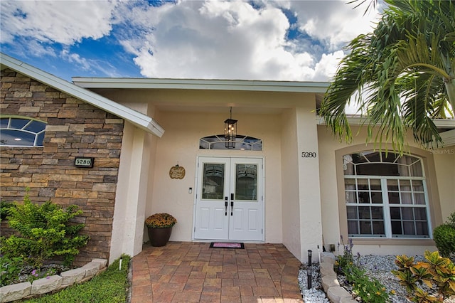 entrance to property featuring french doors