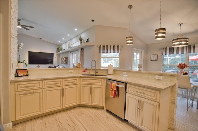 kitchen with dishwasher, light hardwood / wood-style flooring, sink, and vaulted ceiling