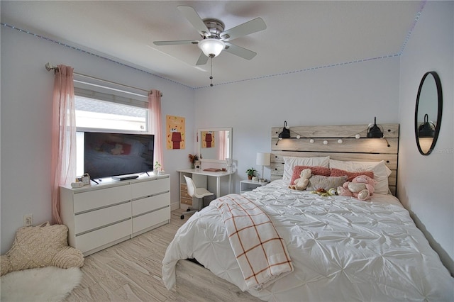 bedroom featuring light wood-type flooring and ceiling fan