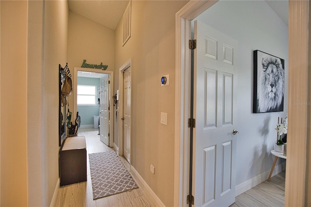 hall with light wood-type flooring