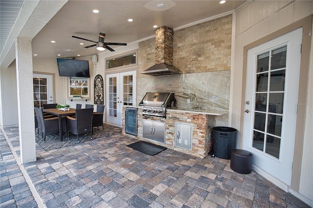 view of patio with wine cooler, exterior kitchen, area for grilling, ceiling fan, and french doors