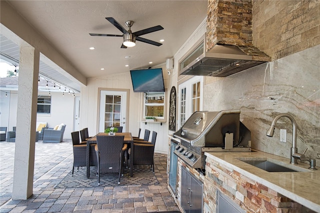 view of patio featuring area for grilling, an outdoor kitchen, ceiling fan, french doors, and sink