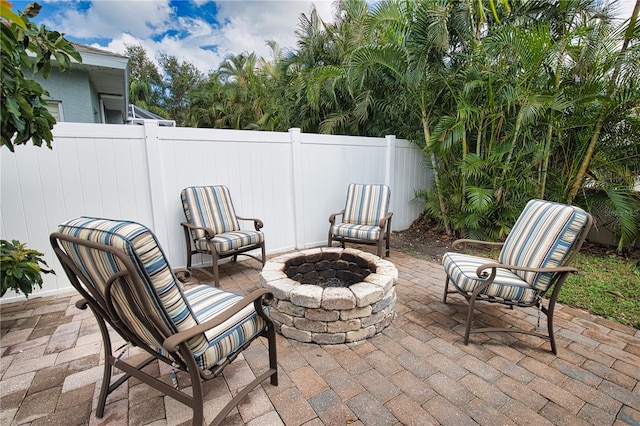 view of patio with an outdoor fire pit