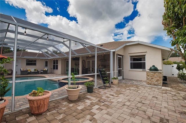 view of swimming pool with a lanai and a patio area