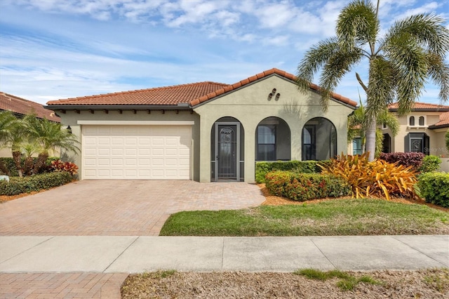 mediterranean / spanish-style home featuring a garage