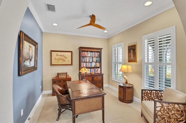 office space with light carpet, ceiling fan, a healthy amount of sunlight, and crown molding