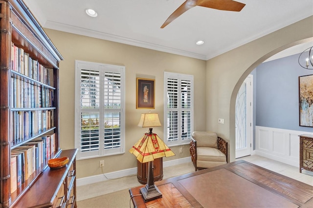 sitting room featuring ornamental molding, ceiling fan, and light tile patterned floors