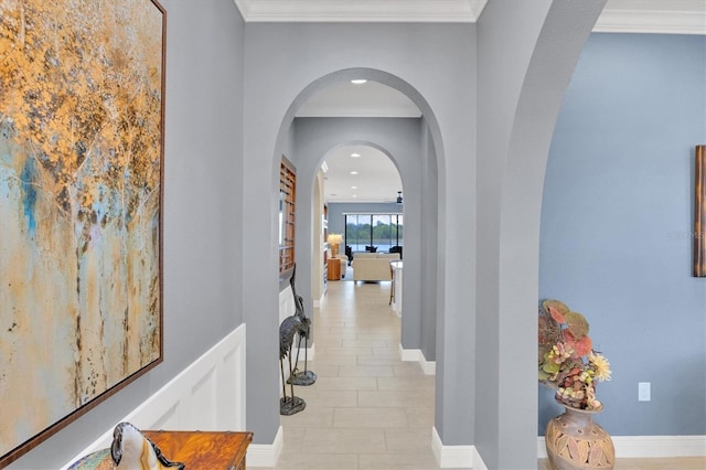 hallway featuring ornamental molding