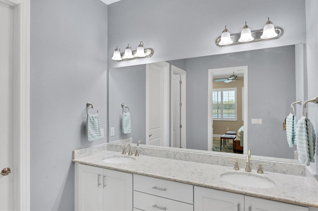 bathroom featuring ceiling fan and vanity