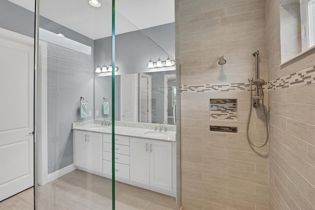 bathroom featuring vanity and a tile shower