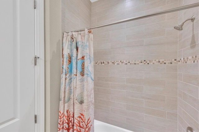 bathroom featuring shower / bath combo with shower curtain