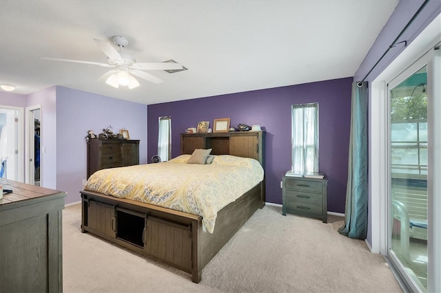 bedroom with ceiling fan and light colored carpet