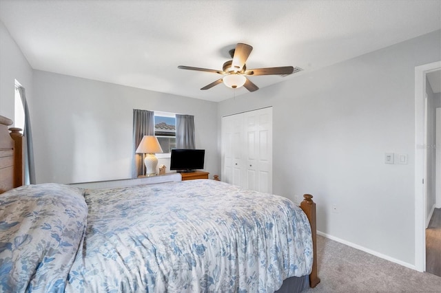 bedroom featuring carpet flooring, ceiling fan, and a closet