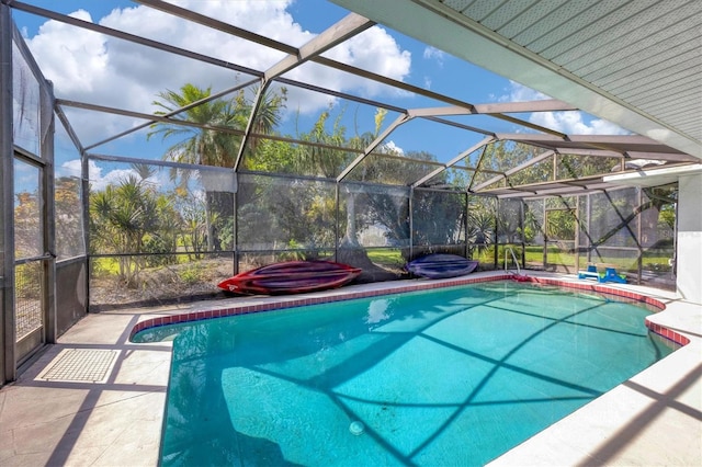 view of pool featuring a jacuzzi, a patio, and glass enclosure