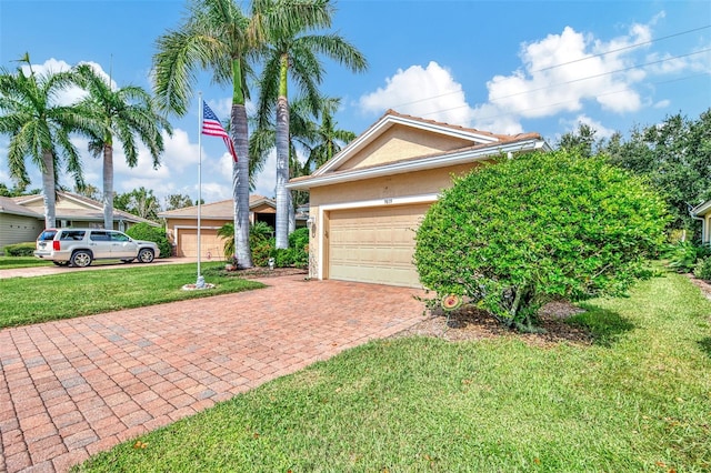 view of side of property featuring a yard and a garage