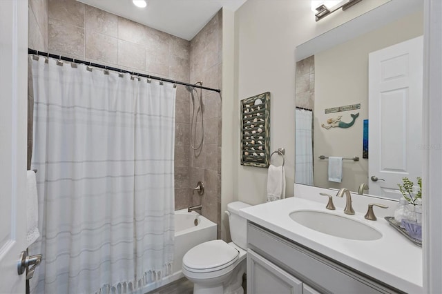 full bathroom with shower / tub combo with curtain, vanity, and toilet