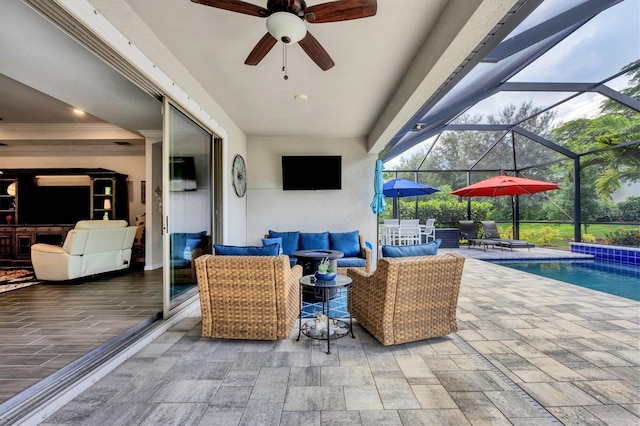 view of patio featuring glass enclosure, outdoor lounge area, and ceiling fan