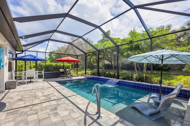 view of pool featuring a lanai, pool water feature, and a patio area