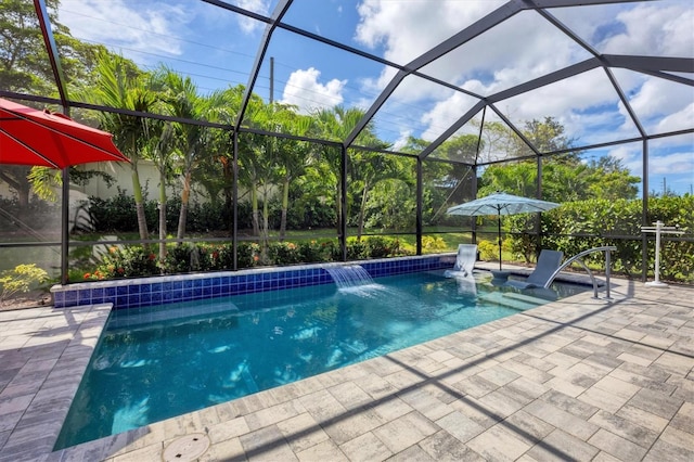 view of swimming pool with a patio area, a lanai, and pool water feature