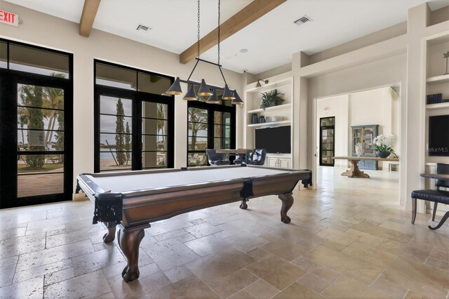 recreation room with beamed ceiling, built in features, and pool table