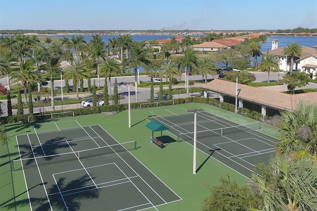 view of sport court featuring a water view