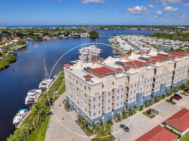 birds eye view of property with a water view