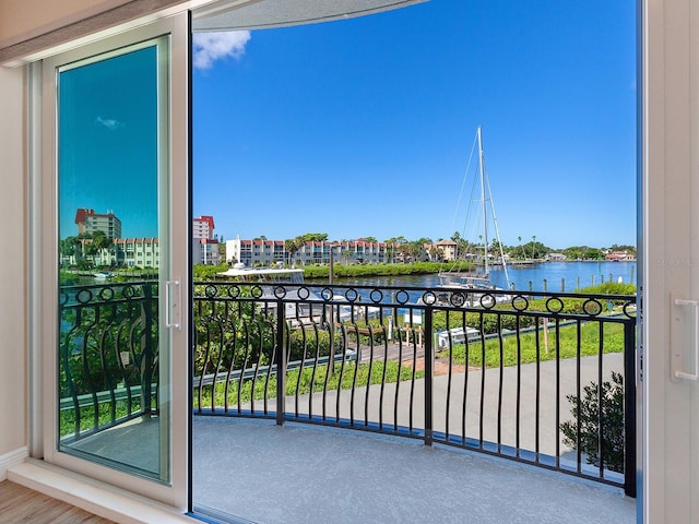 balcony featuring a water view