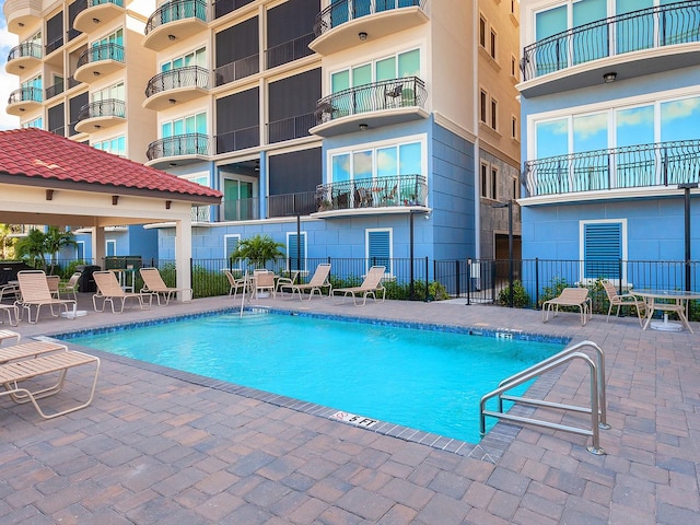 view of swimming pool with a patio