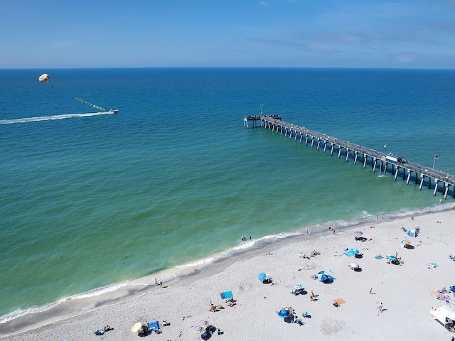 birds eye view of property featuring a view of the beach and a water view