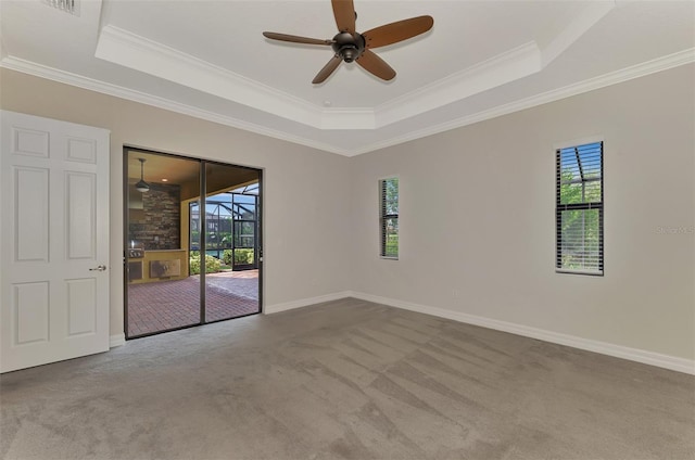 unfurnished room with light carpet, plenty of natural light, and ornamental molding